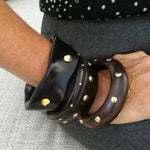 Load image into Gallery viewer, ROUNDED GOLD STUDS EBONY BANGLE
